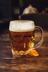 Beer mug on brown wooden table